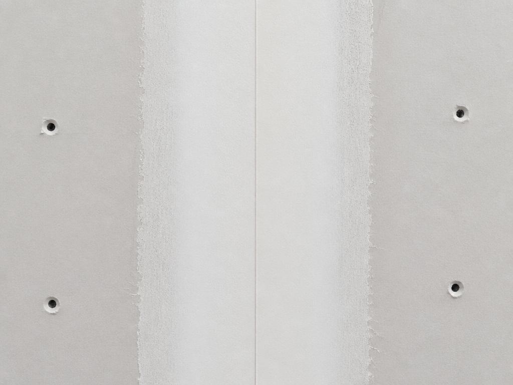 Perfectly taped and mudded drywall joint showing smooth seam finish